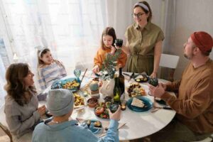 Family enjoying a meal together, sharing stories and laughter around the dining table
